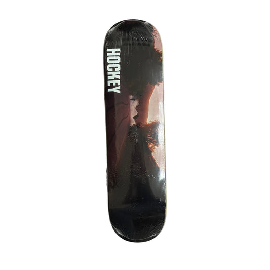 Skateboard deck with 'Hockey' branding on a white surface
