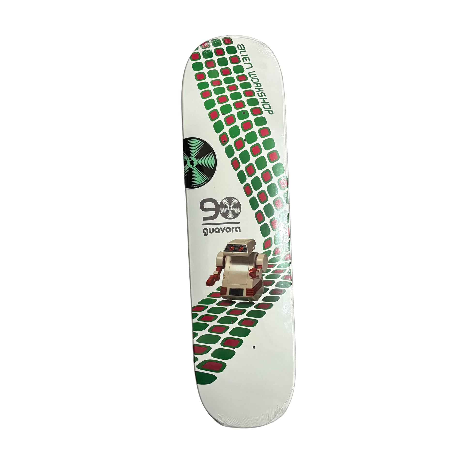 Skateboard deck with green and red pattern on a white surface