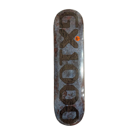 Skateboard deck with 'GX1000' branding on a white surface