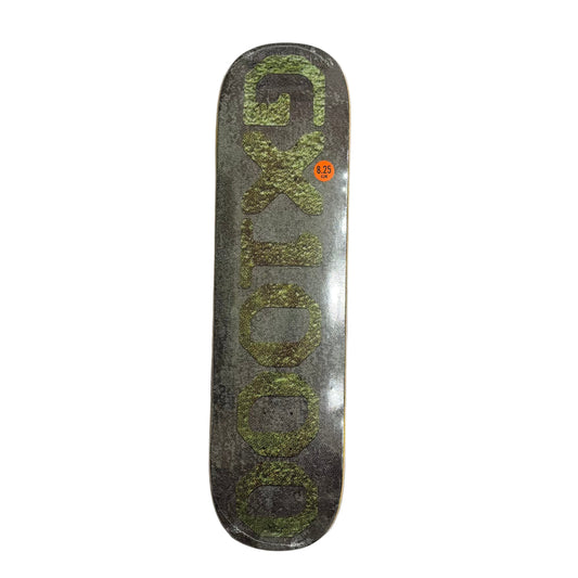 Skateboard deck with 'GX 1000' branding on a white surface