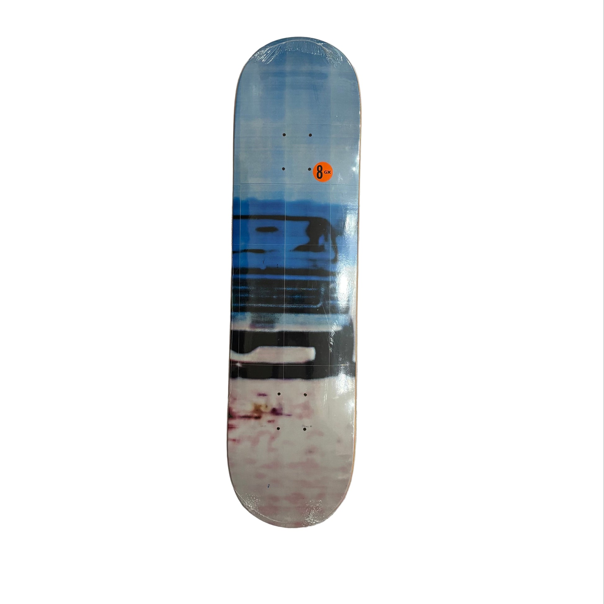 Skateboard deck with a blue and white design on a white surface