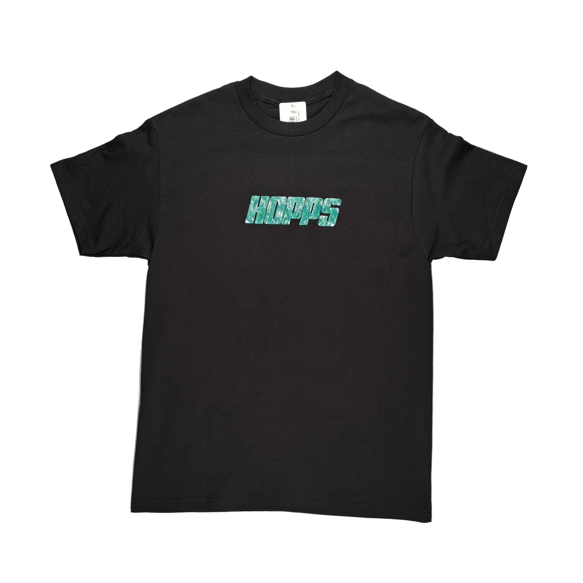 Black t-shirt with green text on a white surface