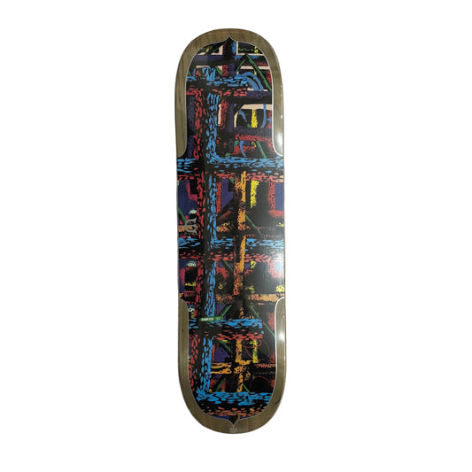 Skateboard deck with a colorful geometric pattern on a white surface