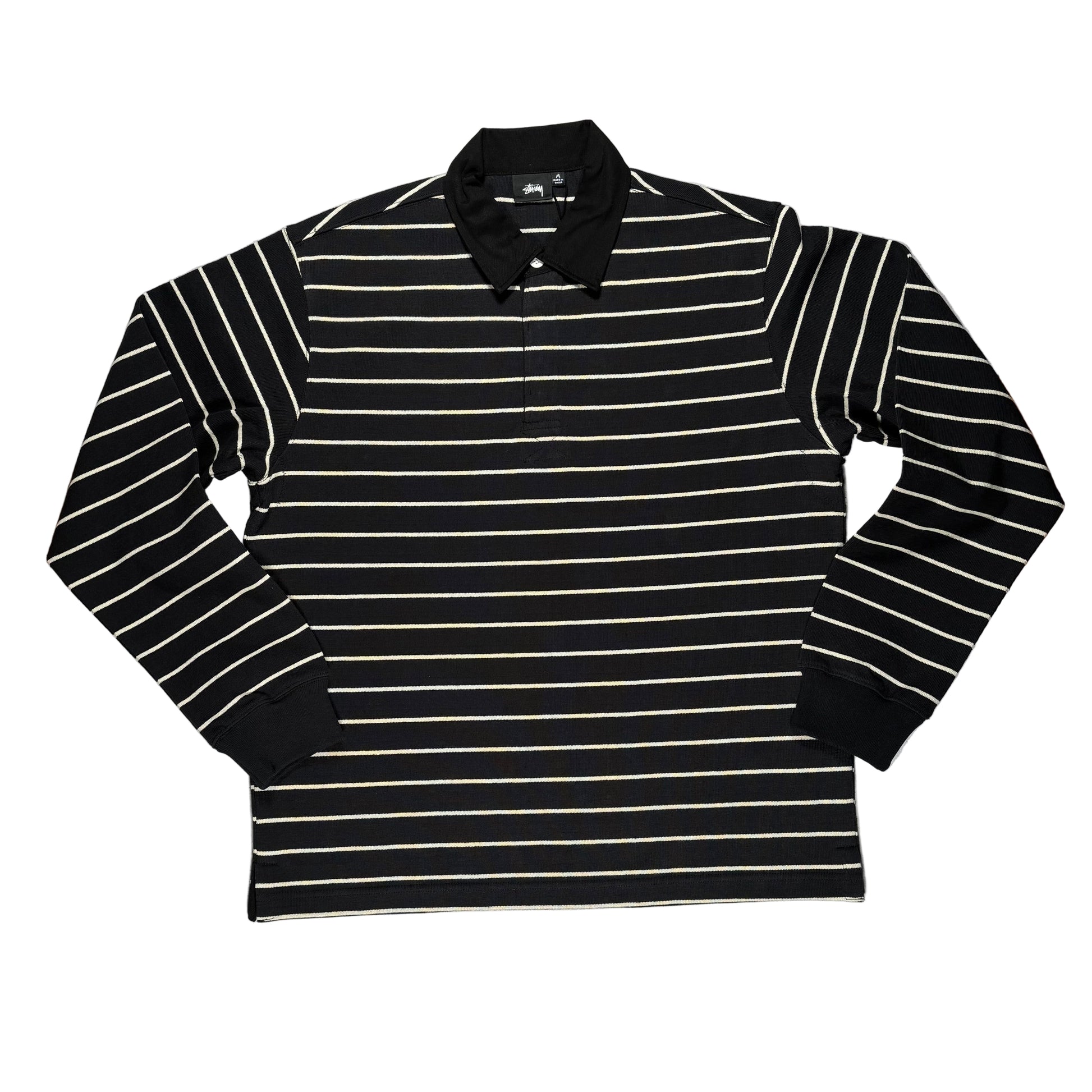 Black and white striped long-sleeve shirt on a white surface 