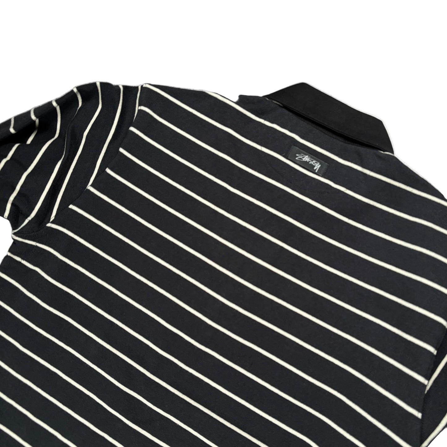 Black and white striped shirt on a white surface