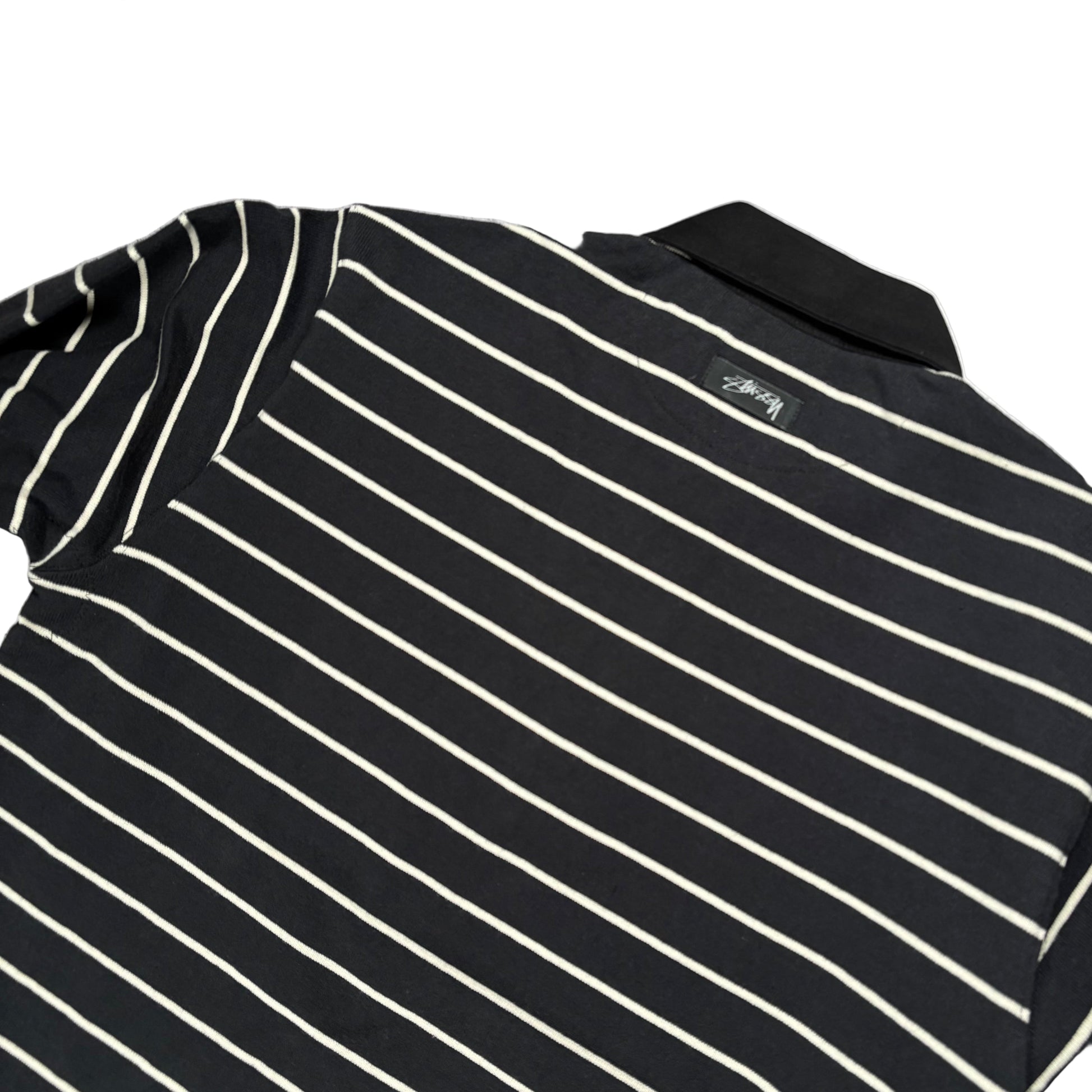 Black and white striped shirt on a white surface
