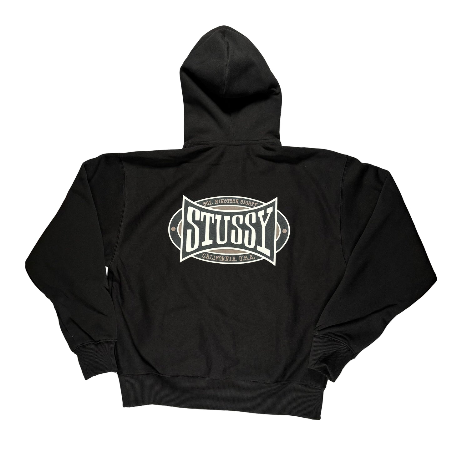 Black hoodie with Stussy logo on a gray surface