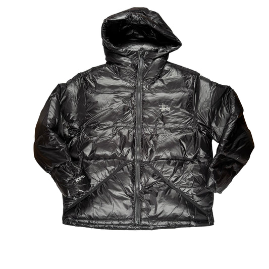 Black puffer jacket on a white background