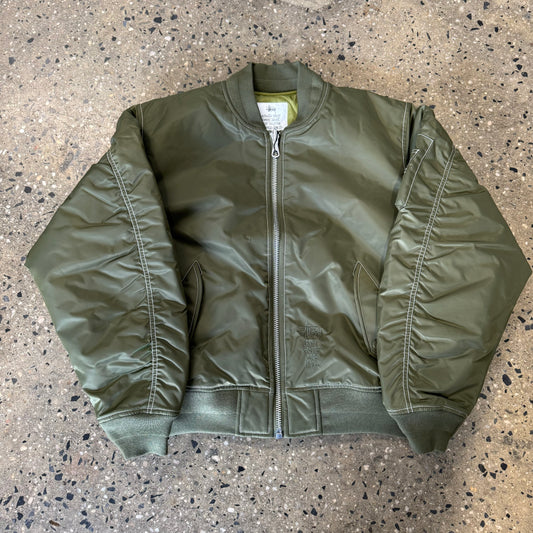 front view of reversible bomber jacket in olive