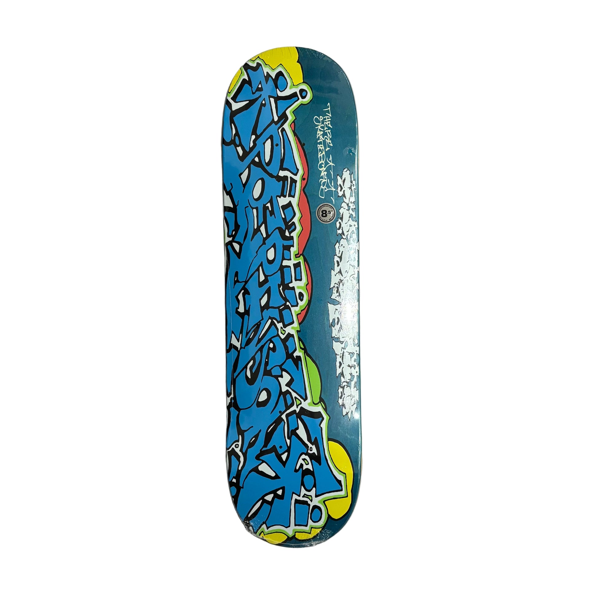 Skateboard deck with colorful graffiti design on a white surface