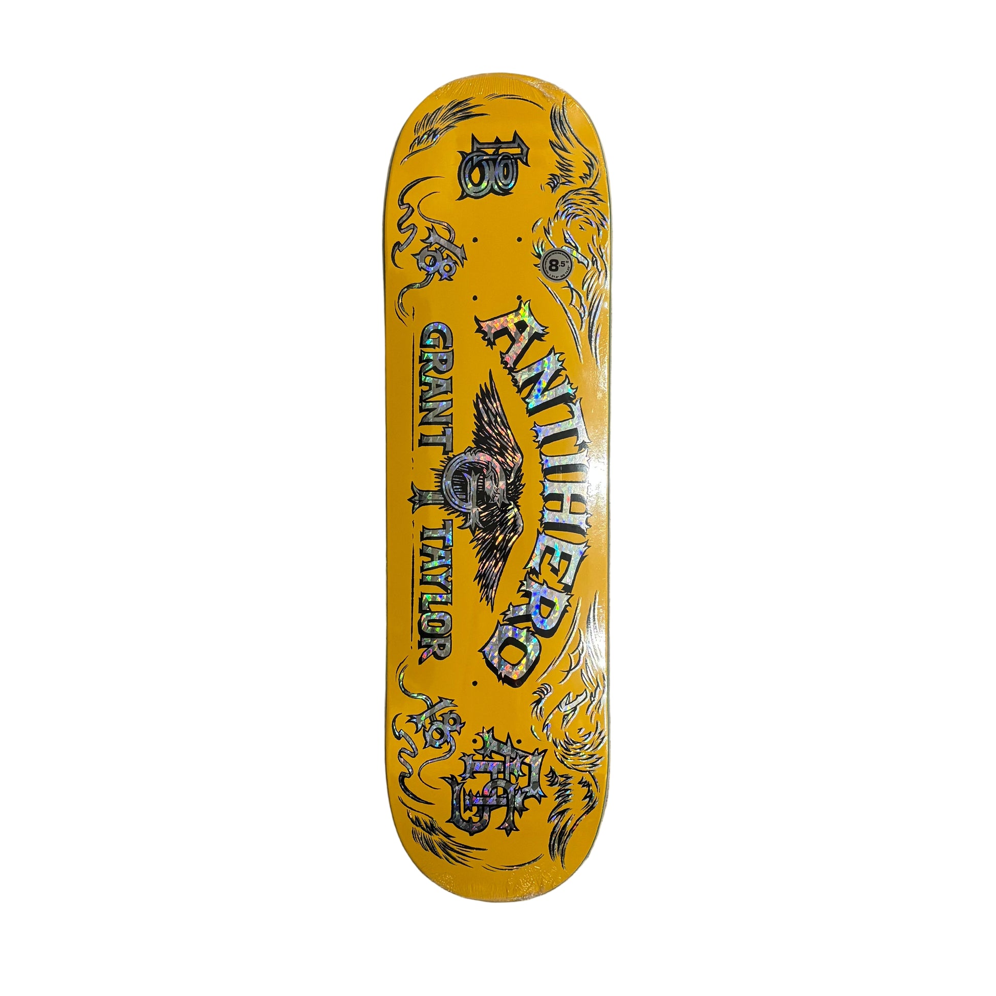 Yellow skateboard deck with black graphics on a white surface