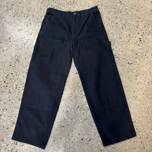 front view of black canvas stussy work pants