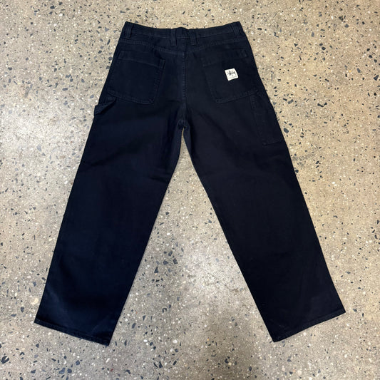 rear view of black canvas stussy work pants