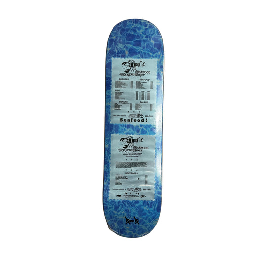 Blue and black skateboard deck with branding on a white surface