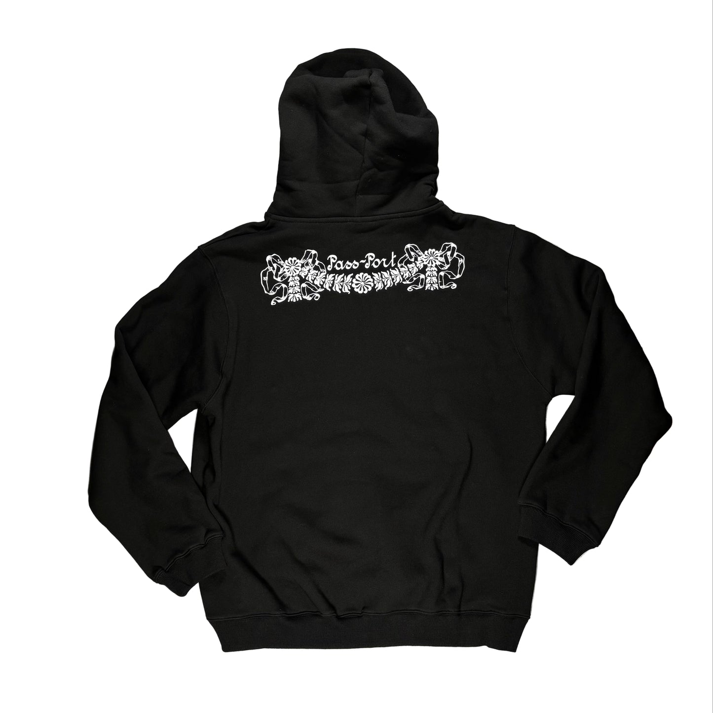Black hoodie with white graphic design on the back, laid flat on a white surface.