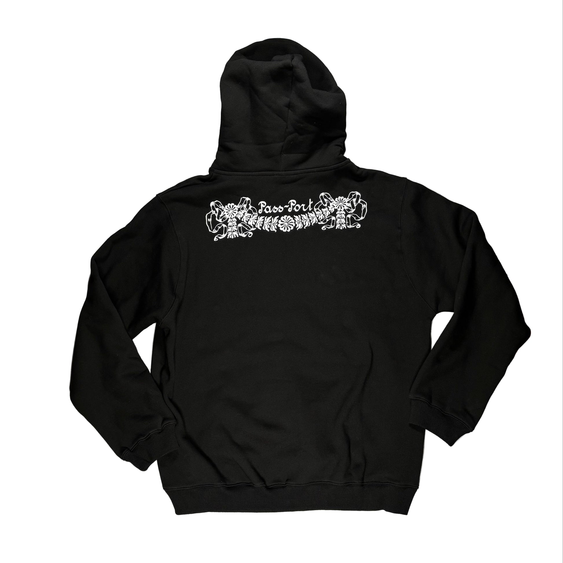 Black hoodie with white graphic design on the back, laid flat on a white surface.