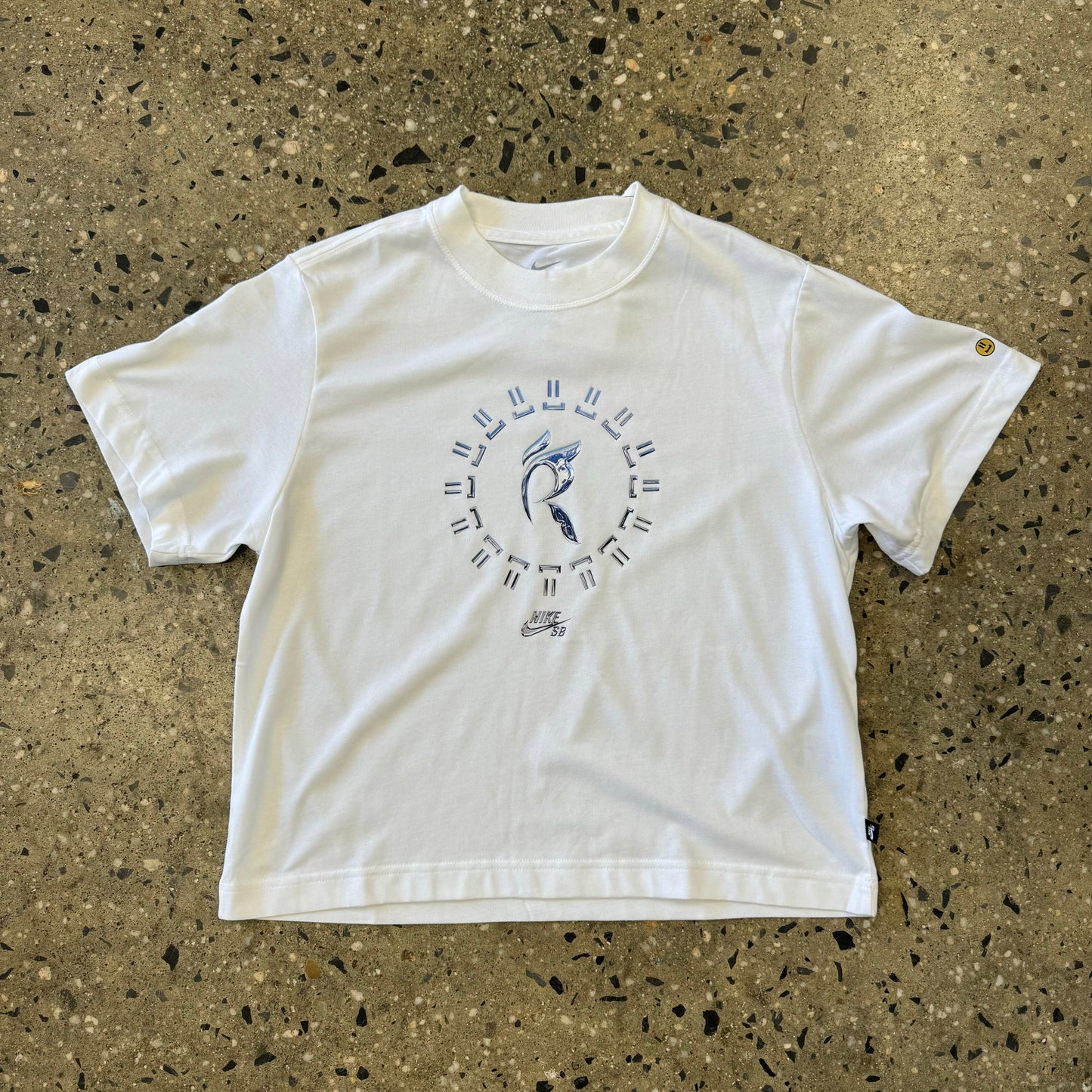 white T-shirt with abstract logo