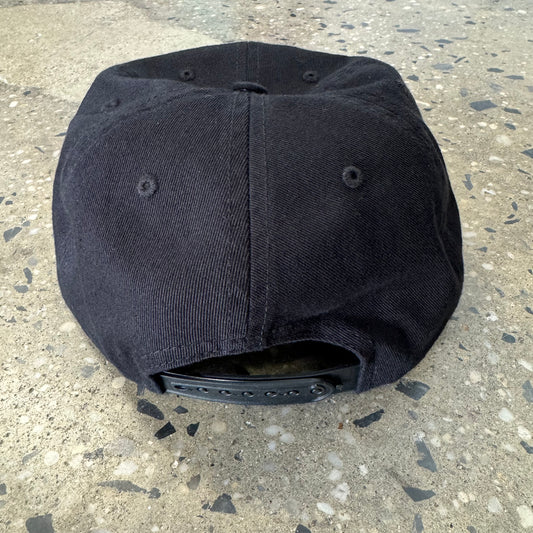 back view of black hat