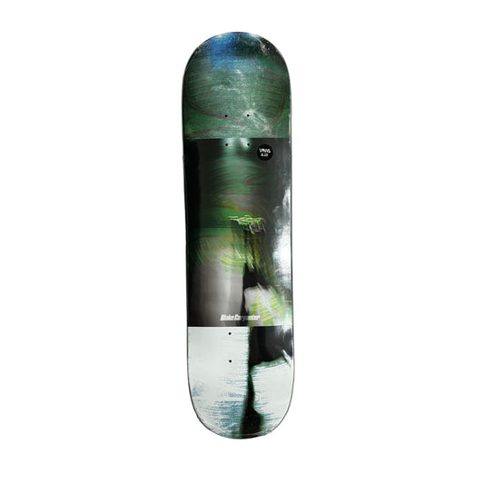 Skateboard deck with a green and black design on a white surface