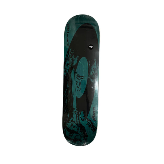 Skateboard deck with a black and teal on a white surface