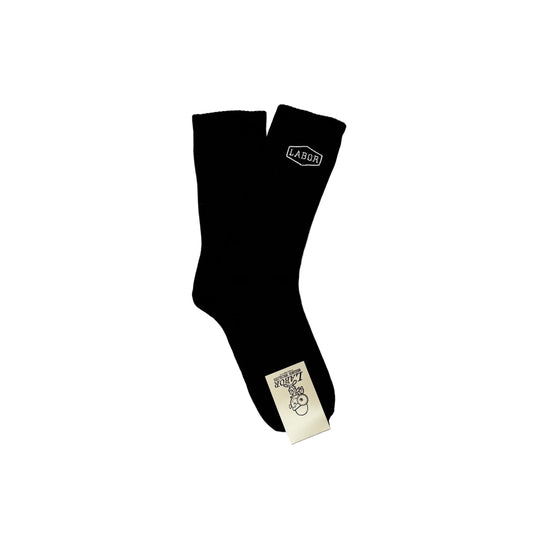 Black socks with visible branding on a white surface