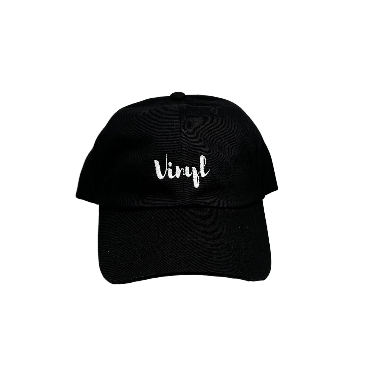 Black cap with 'vinyl' text on a white surface against a white background