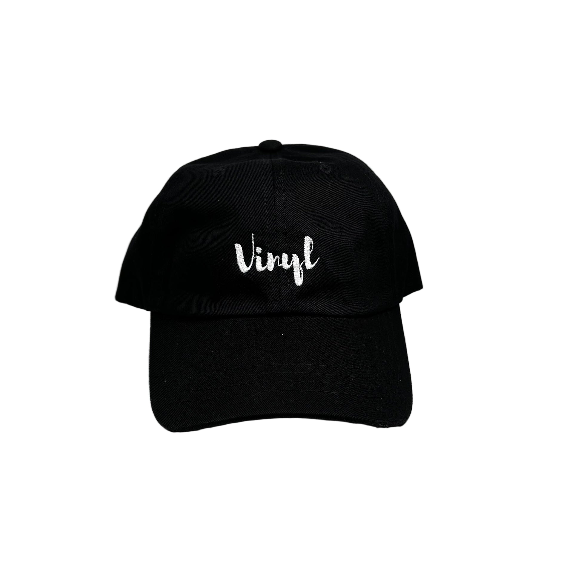 Black cap with 'vinyl' text on a white surface against a white background