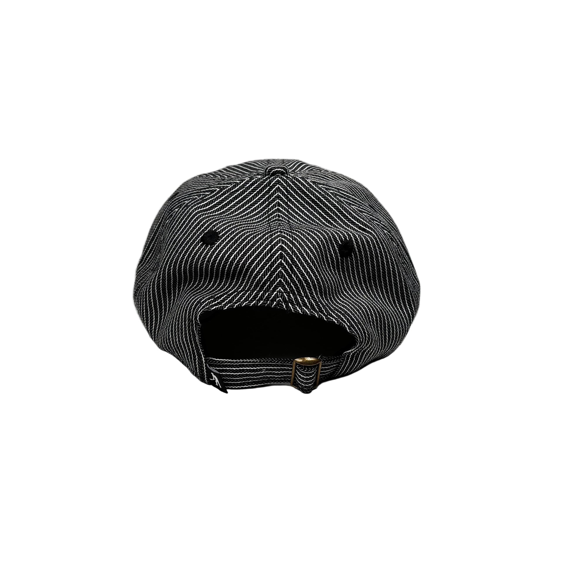 Black and white checkered cap on a white pedestal against a gray background