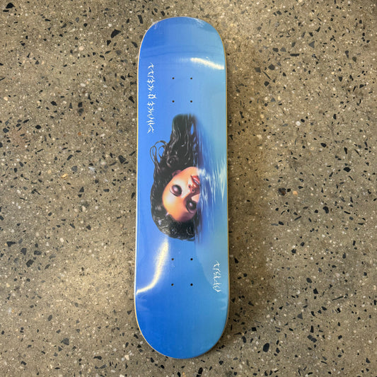 lady laying in water on blue skate deck