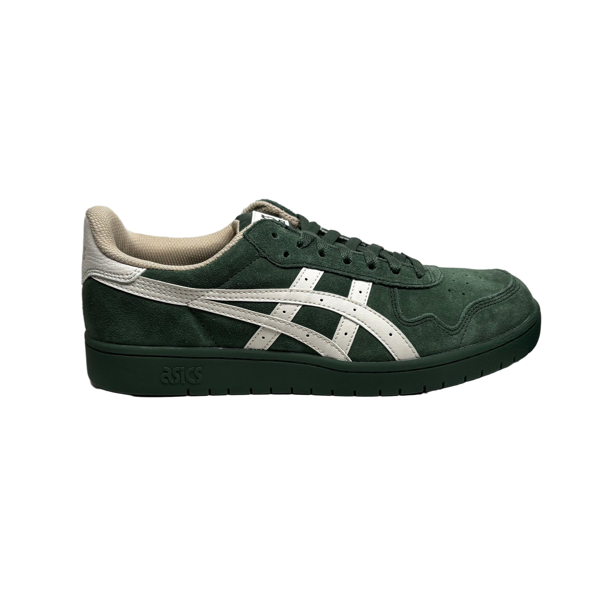 Green and white sneaker on a white block with a gray background