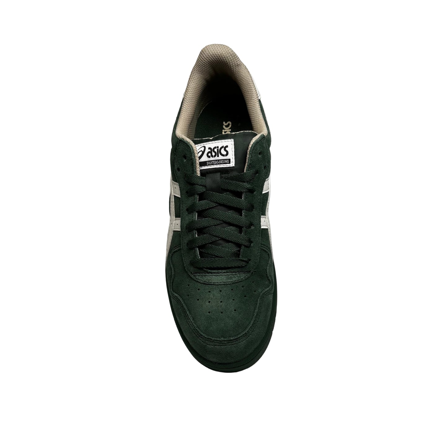 Green sneaker with white label on a white platform against a gray background