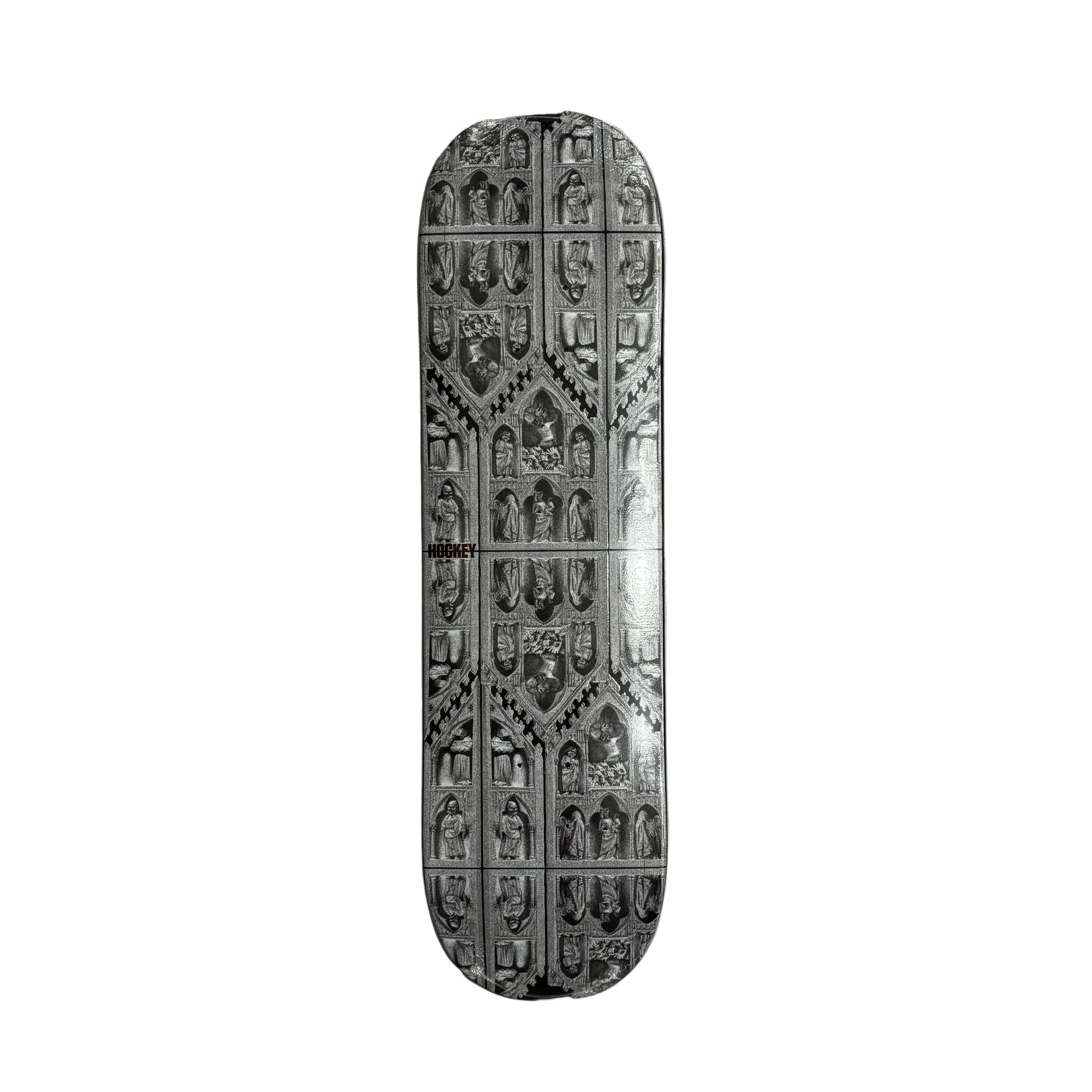 Decorative skateboard deck with intricate patterns on a white surface