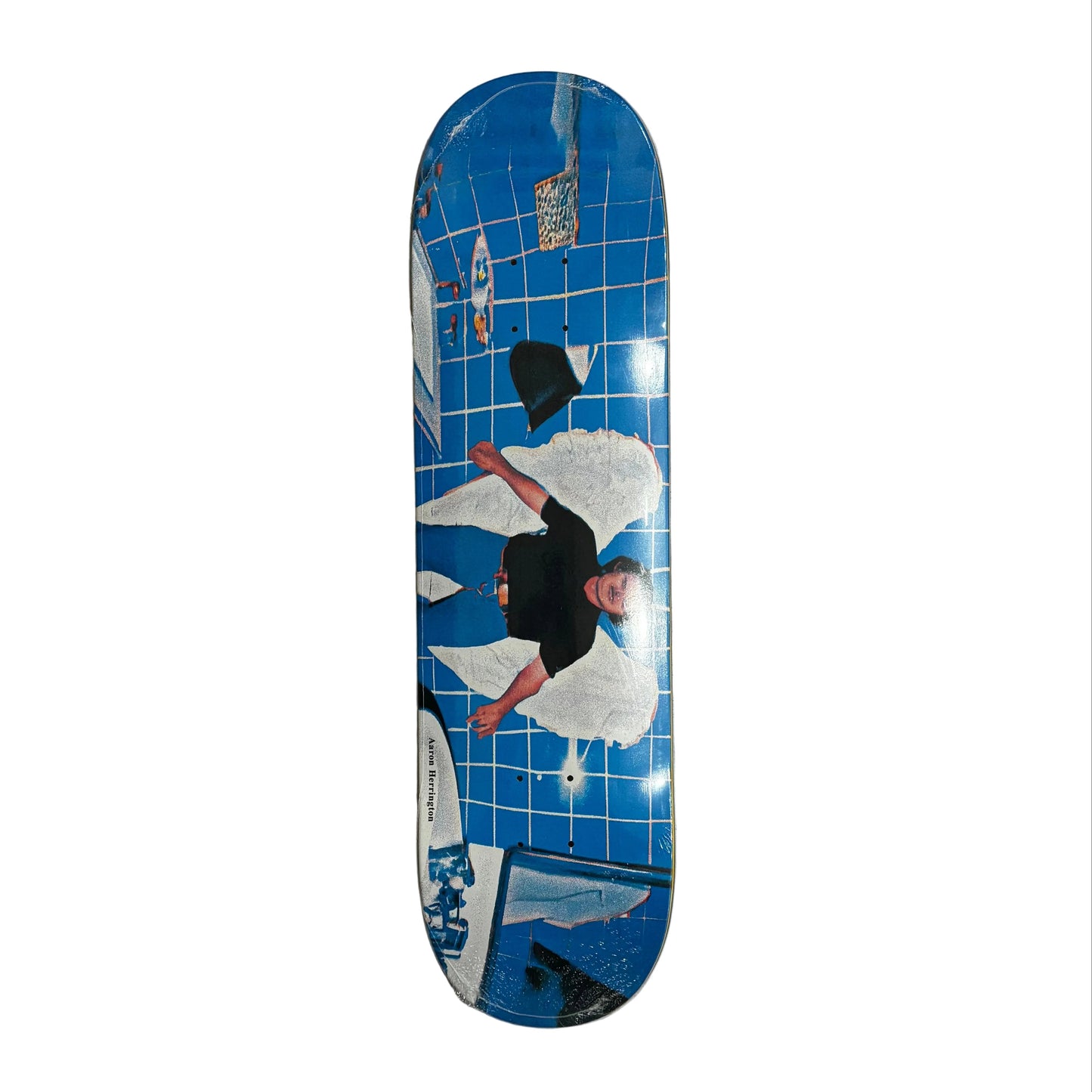 Skateboard deck with a graphic design of a person in a black shirt and white pants on a blue and white abstract background