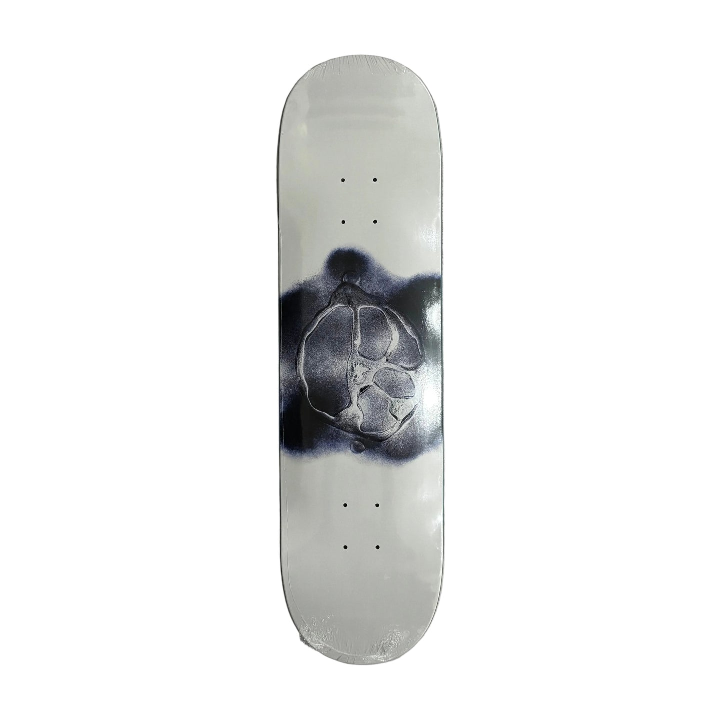 Skateboard deck with a black and white design on a white surface
