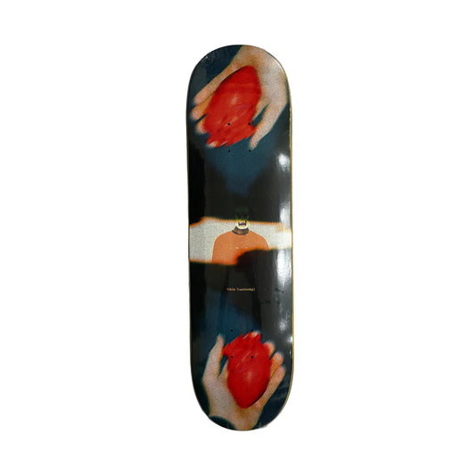 Skateboard deck with artistic design of hands holding hearts on a white surface.