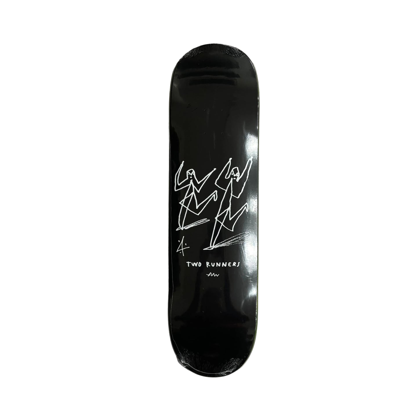 Black skateboard deck with white graphics on a white surface