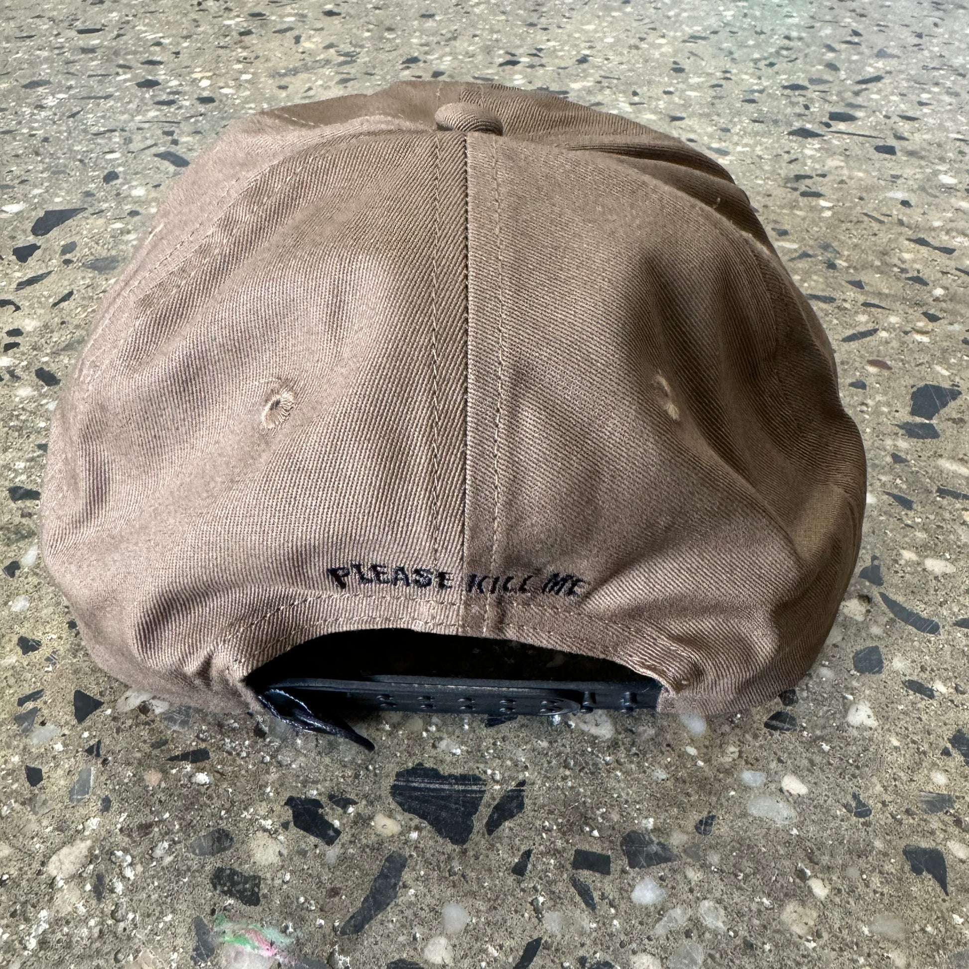back of khaki hat