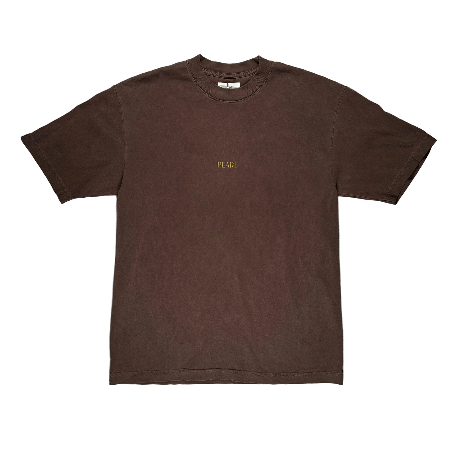 Brown t-shirt with 'PEARL' logo on a gray surface