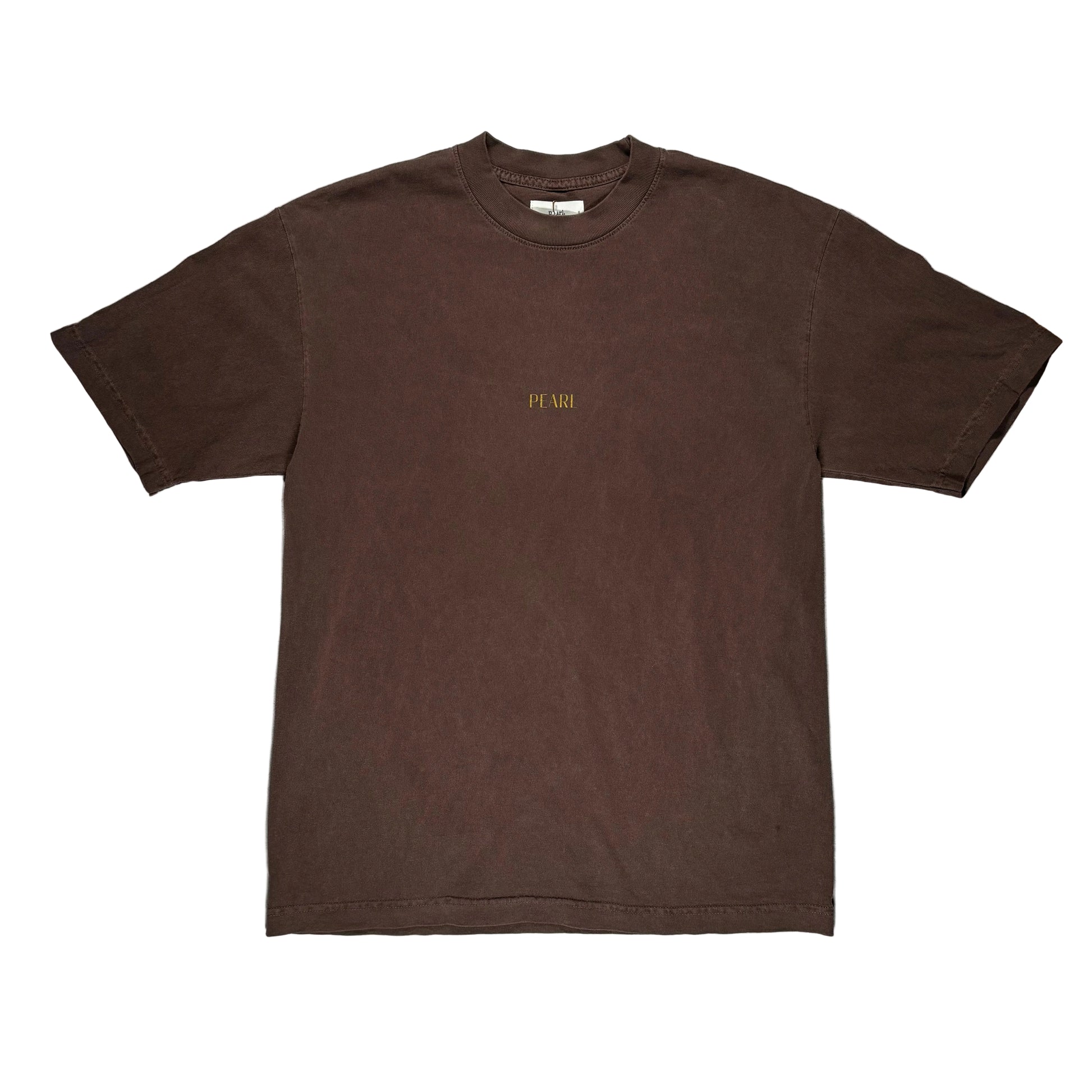 Brown t-shirt with 'PEARL' logo on a gray surface