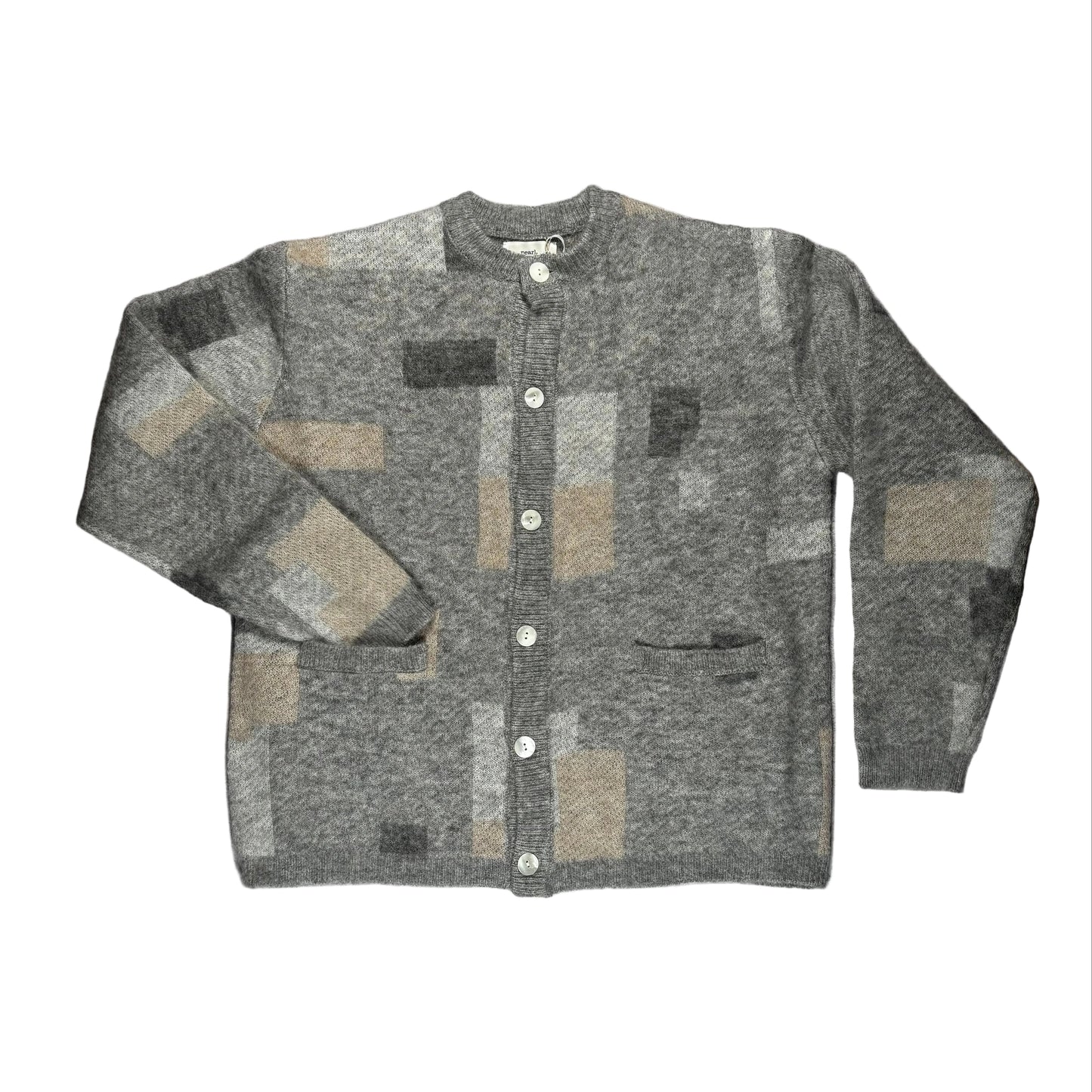 Gray patchwork cardigan on a white surface