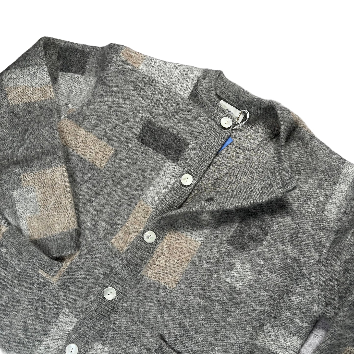 Gray checkered sweater on a white surface