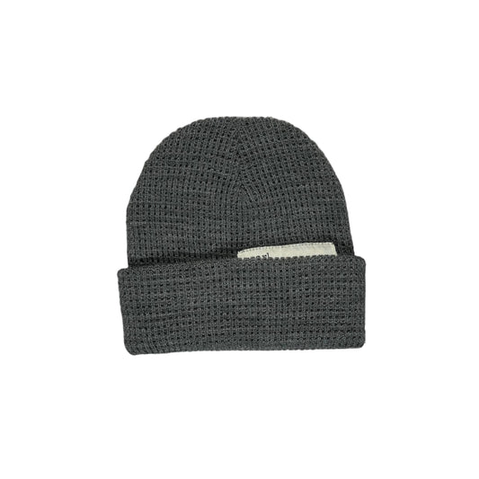 Dark gray knit beanie on a white surface