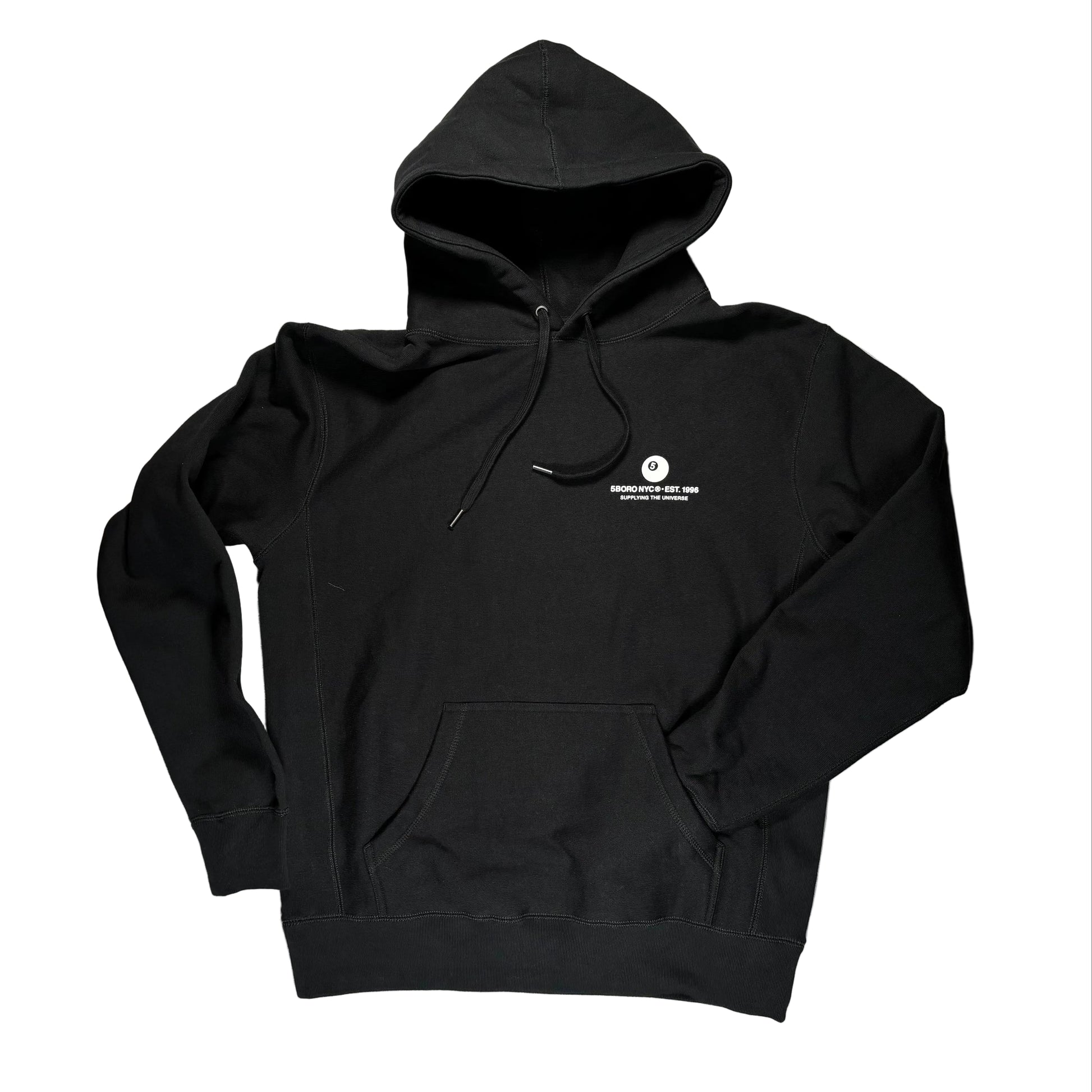 Black hoodie with a small white logo on a white surface