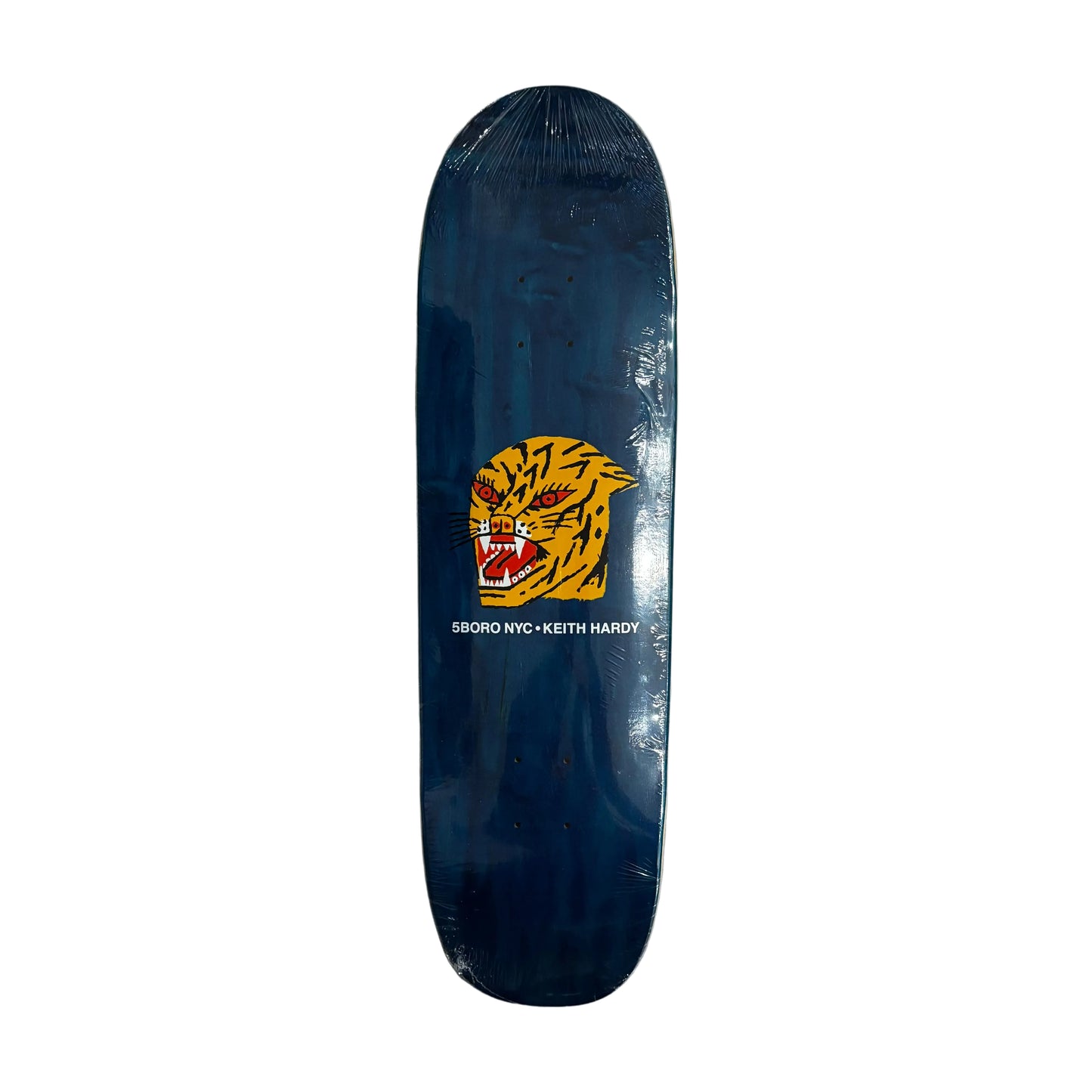 shaped Skateboard deck with a tiger logo on a white surface