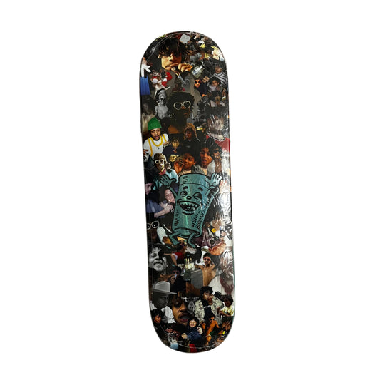 Skateboard deck with collage design on a white surface