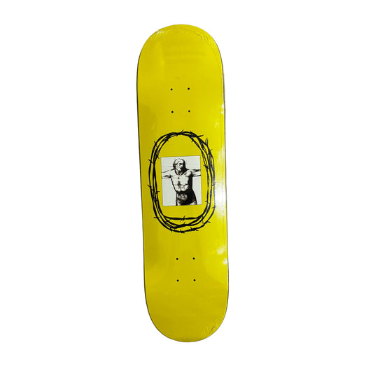 Yellow skateboard deck with a graphic design on a white surface