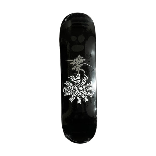 Black skateboard deck with white graphics on a white surface