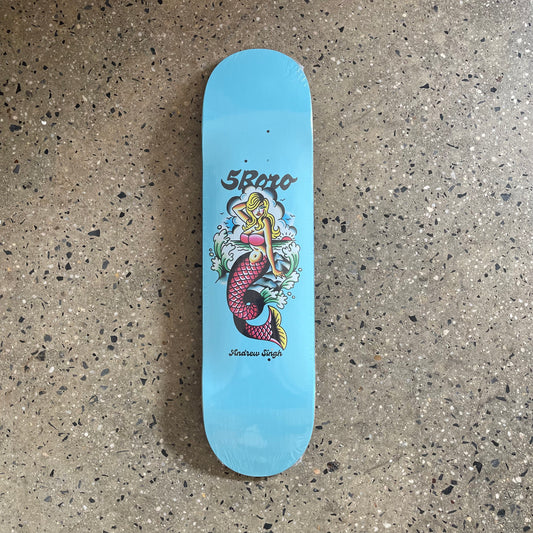 Blue skate deck with classic tattoo art style mermaid on the bottom