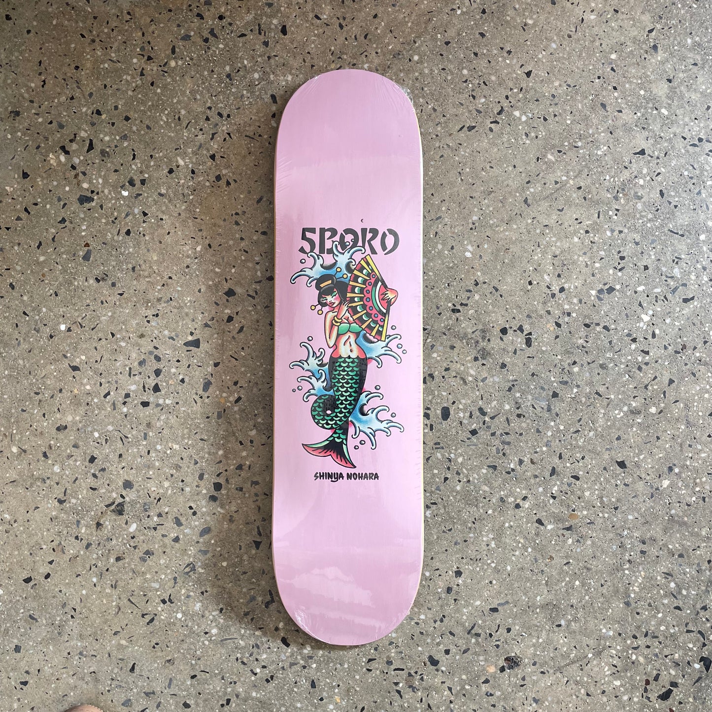 Pink deck with mermaid with umbrella