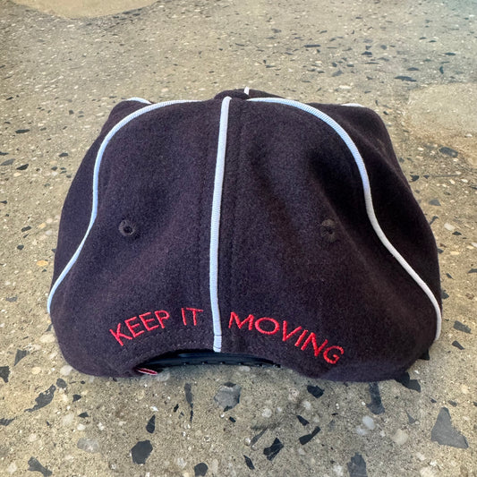 rear of hat, keep it moving arch logo printed on back of hat